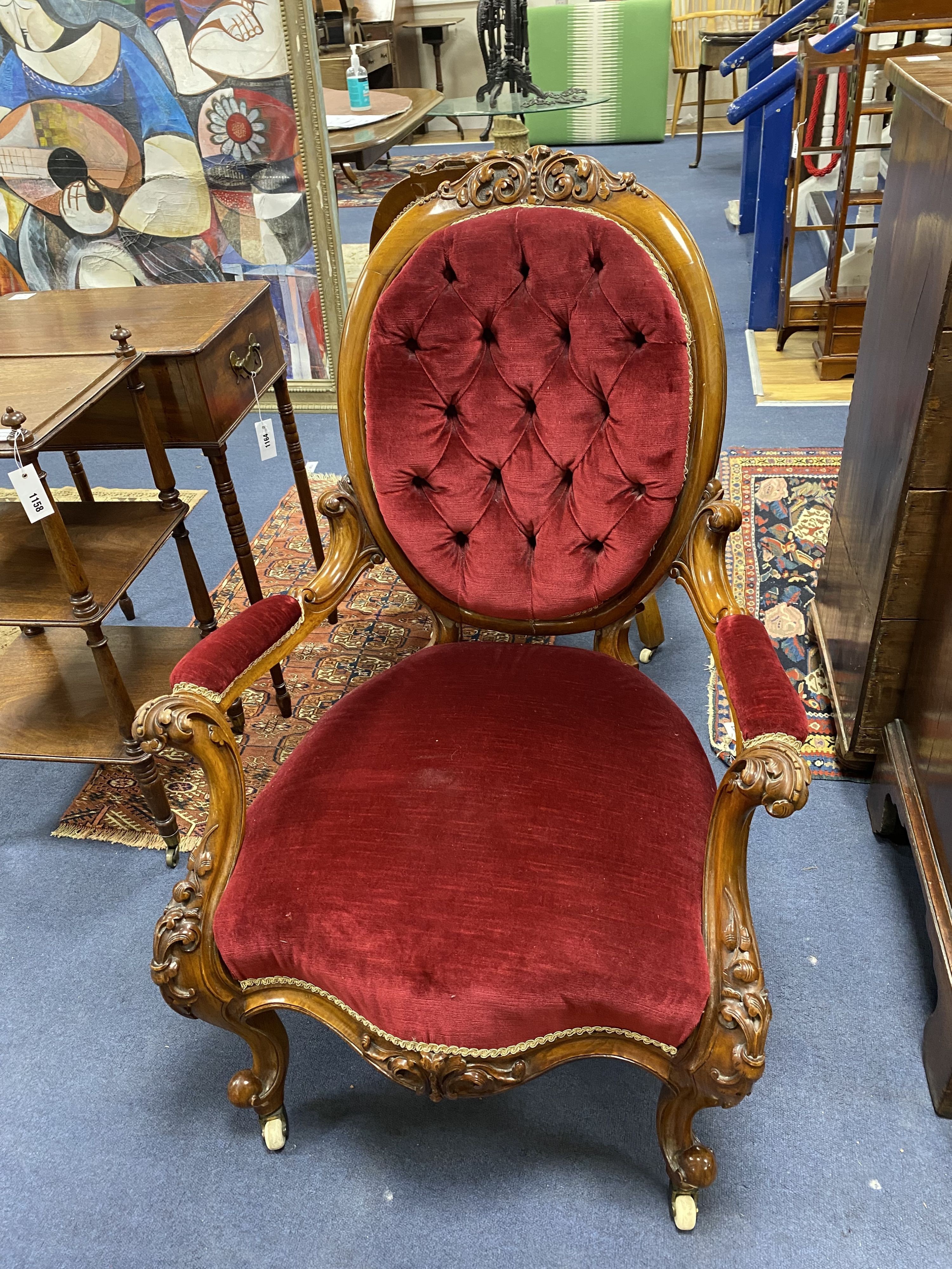 A Victorian carved walnut armchair and matching nursing chair